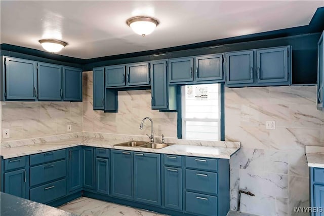 807 Tifft St, Buffalo, NY 14220 - kitchen with blue cabinetry, light marble finish floors, and tasteful backsplash