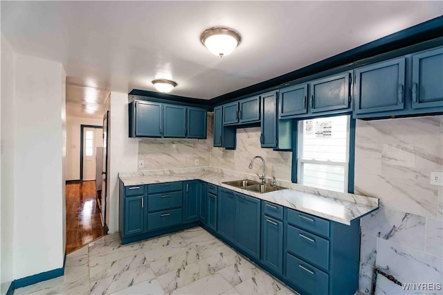 807 Tifft St, Buffalo, NY 14220 - kitchen with blue cabinetry and light marble finish floors
