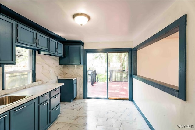 807 Tifft St, Buffalo, NY 14220 - kitchen with plenty of natural light, light marble finish floors, light countertops, and decorative backsplash