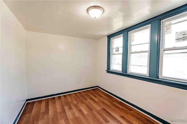 807 Tifft St, Buffalo, NY 14220 - spare room with baseboards and wood finished floors