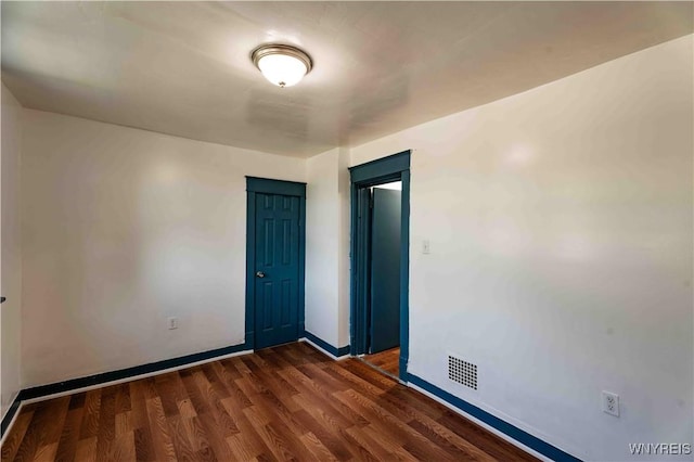 807 Tifft St, Buffalo, NY 14220 - spare room featuring dark wood-type flooring and baseboards