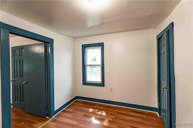 807 Tifft St, Buffalo, NY 14220 - empty room with wood finished floors and baseboards