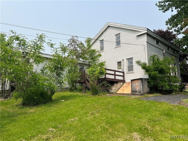 4535 Holley Byron Rd, Clarendon, NY 14470 - rear view of property with a wooden deck and a lawn