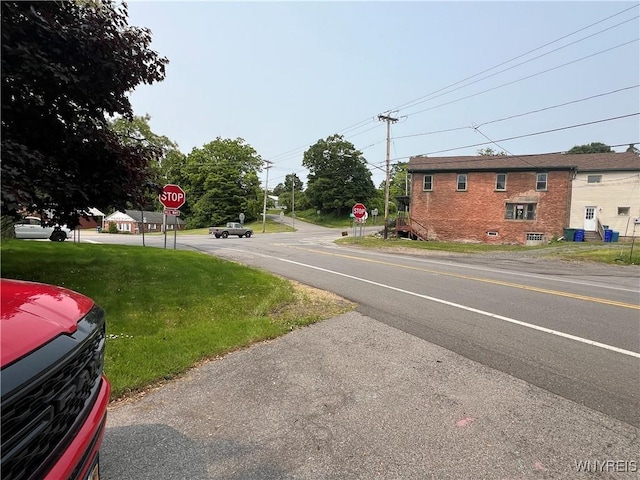 4535 Holley Byron Rd, Clarendon, NY 14470 - view of asphalt street featuring traffic signs