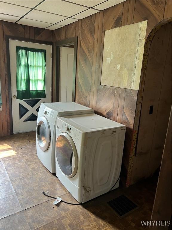 4535 Holley Byron Rd, Clarendon, NY 14470 - washroom featuring wooden walls and washer and clothes dryer