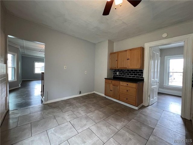 288 Abbott Rd, Buffalo, NY 14220 - kitchen with a ceiling fan, dark countertops, decorative backsplash, and tile patterned flooring