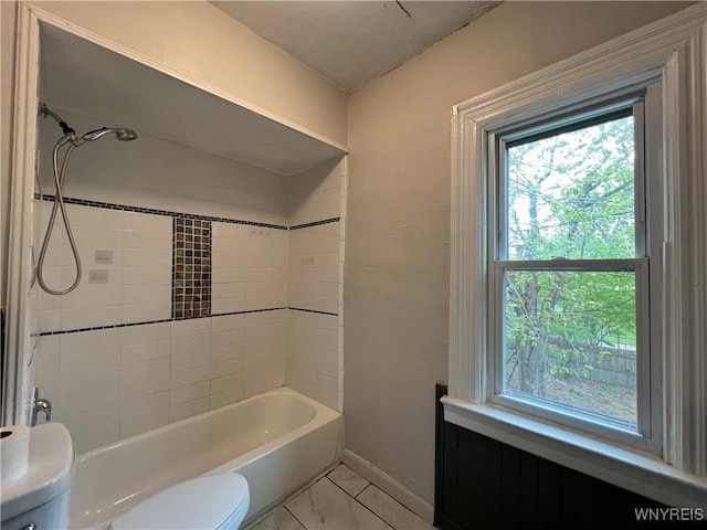 288 Abbott Rd, Buffalo, NY 14220 - bathroom featuring healthy amount of natural light, marble finish flooring, and tub / shower combination