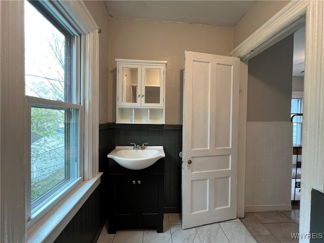288 Abbott Rd, Buffalo, NY 14220 - bathroom featuring vanity and a wainscoted wall