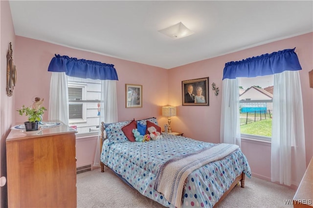 2482 Grand Ave, Niagara Falls, NY 14301 - bedroom featuring light carpet and baseboards