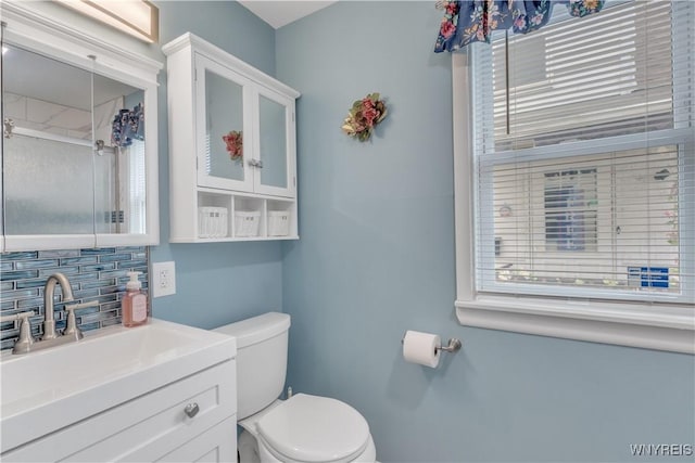 2482 Grand Ave, Niagara Falls, NY 14301 - bathroom with decorative backsplash, vanity, and an enclosed shower