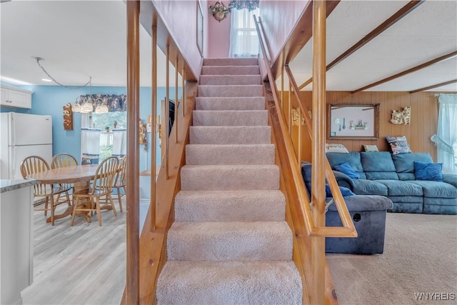 2482 Grand Ave, Niagara Falls, NY 14301 - stairway with wood finished floors, beamed ceiling, and wood walls