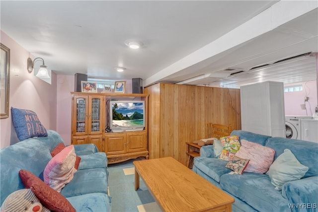 2482 Grand Ave, Niagara Falls, NY 14301 - living area with washer and dryer and wood walls