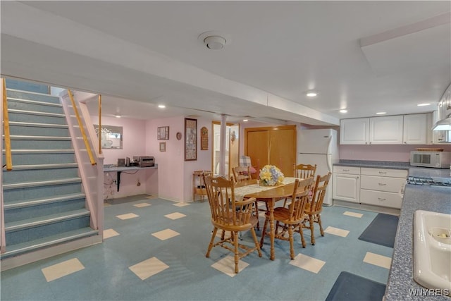 2482 Grand Ave, Niagara Falls, NY 14301 - dining space featuring tile patterned floors, stairs, and recessed lighting