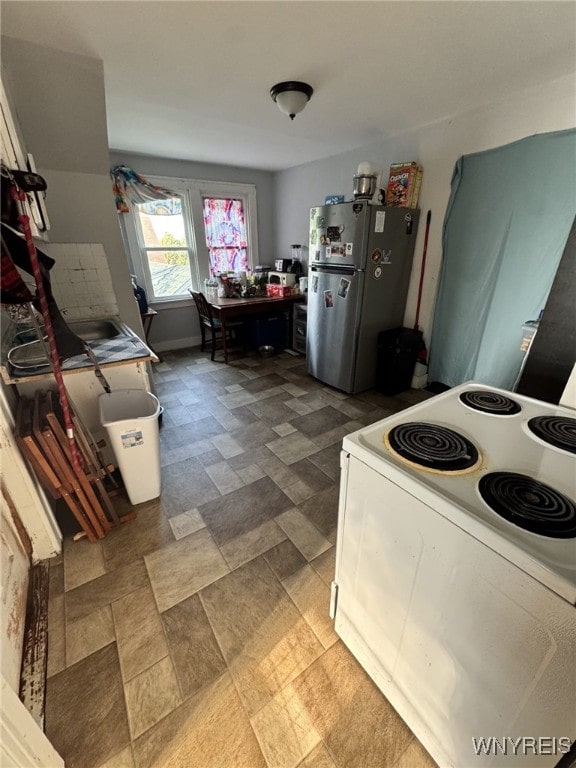 545 Tronolone Pl, Niagara Falls, NY 14301 - kitchen featuring white range with electric stovetop and freestanding refrigerator