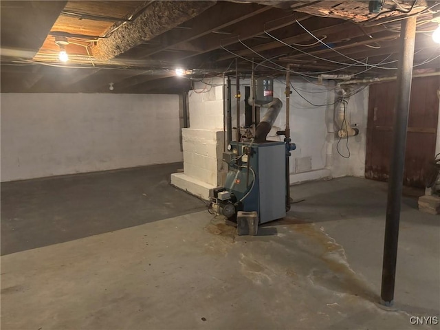 1046 Ammon Rd, Lewis, NY 13489 - unfinished below grade area featuring a heating unit