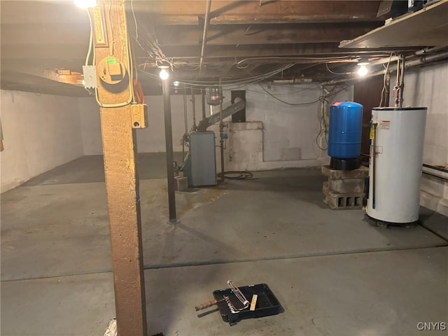 1046 Ammon Rd, Lewis, NY 13489 - unfinished below grade area with water heater, a water pressure tank, and a heating unit
