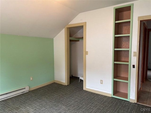 1046 Ammon Rd, Lewis, NY 13489 - unfurnished bedroom with a baseboard radiator, carpet flooring, vaulted ceiling, and a closet