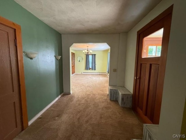 1046 Ammon Rd, Lewis, NY 13489 - hallway with arched walkways, carpet, a chandelier, a textured ceiling, and a baseboard radiator