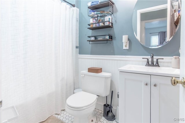 311 Iroquois Ave W, Watertown City, NY 13601 - full bathroom with a wainscoted wall, vanity, and shower / bath combo with shower curtain