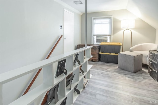 311 Iroquois Ave W, Watertown City, NY 13601 - hallway featuring lofted ceiling, light wood finished floors, and cooling unit