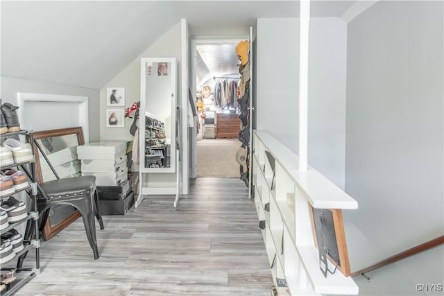 311 Iroquois Ave W, Watertown City, NY 13601 - corridor with light wood finished floors and vaulted ceiling