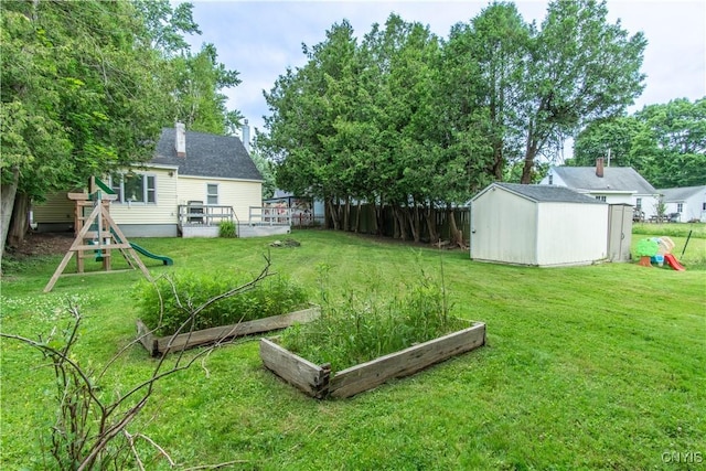 311 Iroquois Ave W, Watertown City, NY 13601 - fenced backyard with a shed and a garden