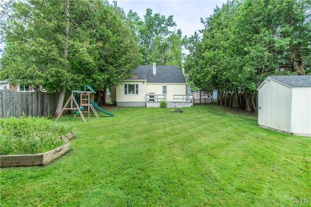 311 Iroquois Ave W, Watertown City, NY 13601 - fenced backyard with a shed, a vegetable garden, and a playground