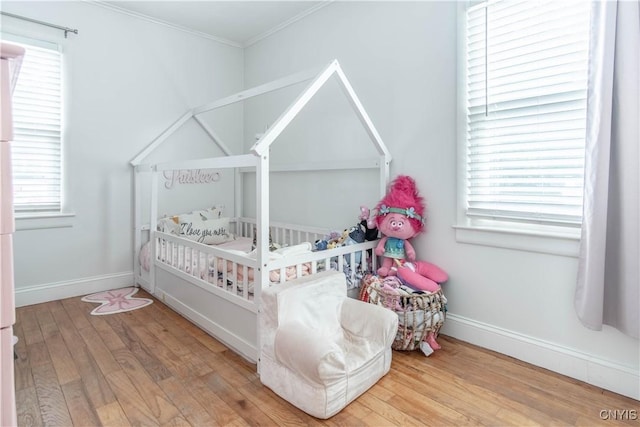 311 Iroquois Ave W, Watertown City, NY 13601 - bedroom featuring wood finished floors and crown molding