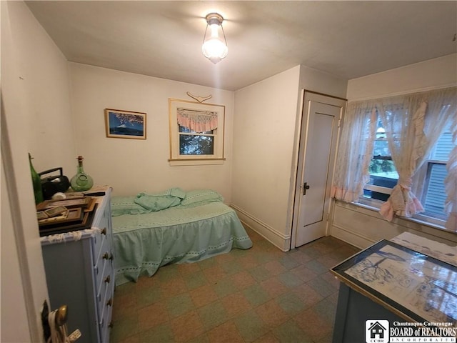 421 Falconer St, Jamestown, NY 14701 - bedroom with dark floors and baseboards