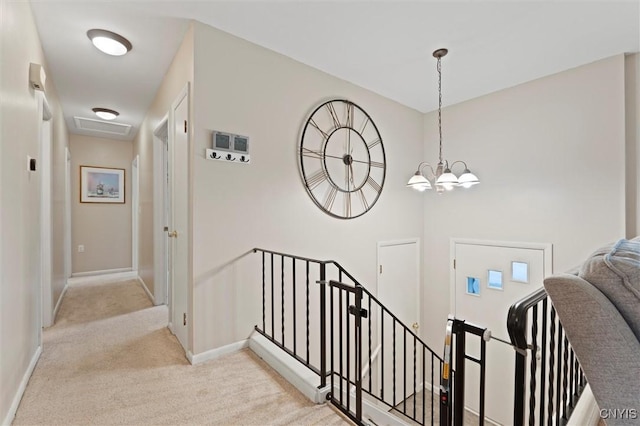 103 Walrath Dr, Sullivan, NY 13037 - stairway with carpet floors and a chandelier