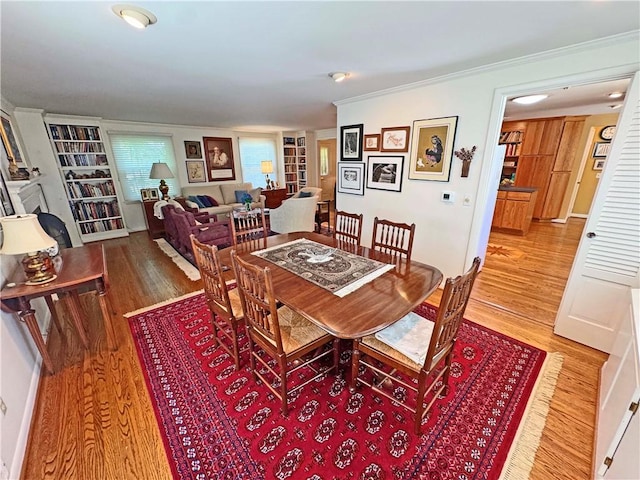 10 Danbury Cir N, Brighton, NY 14618 - dining room with wood finished floors, crown molding, and built in shelves
