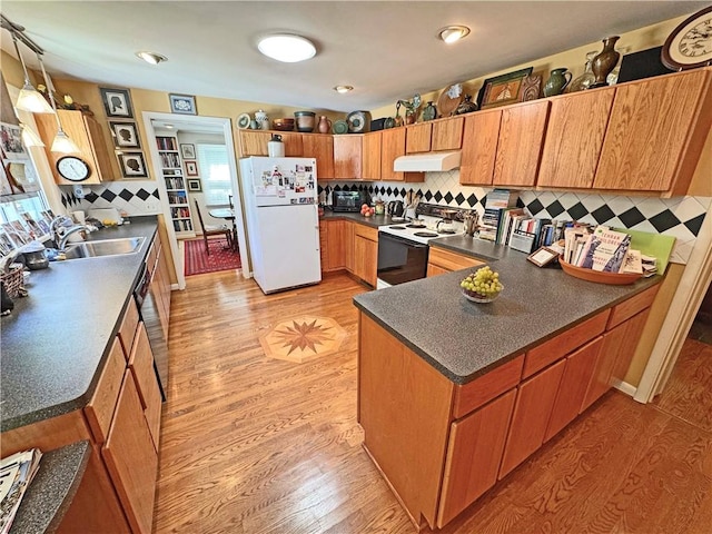 10 Danbury Cir N, Brighton, NY 14618 - kitchen with electric range, freestanding refrigerator, under cabinet range hood, a peninsula, and dark countertops