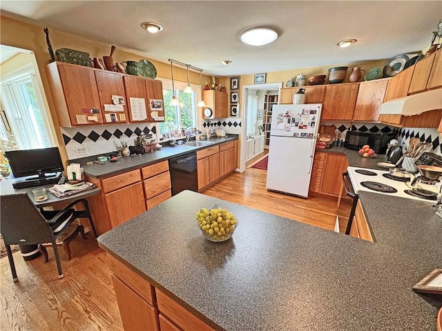 10 Danbury Cir N, Brighton, NY 14618 - kitchen with black appliances, dark countertops, under cabinet range hood, and light wood-style floors