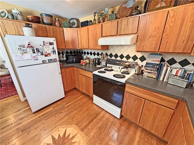 10 Danbury Cir N, Brighton, NY 14618 - kitchen with range hood, white appliances, dark countertops, light wood-style flooring, and tasteful backsplash