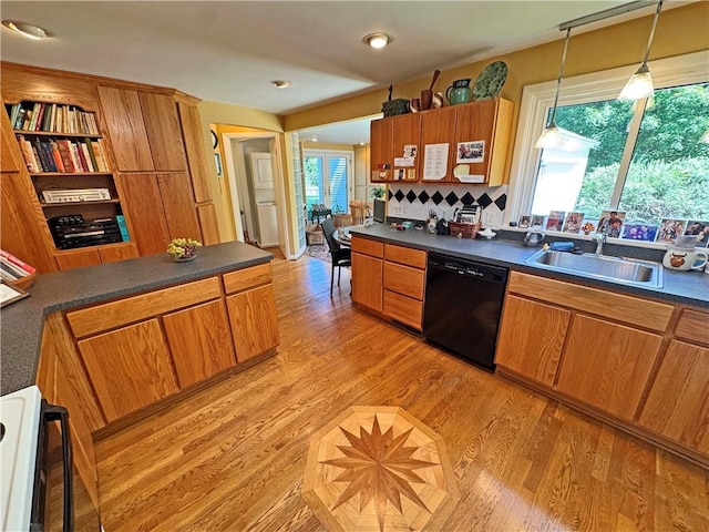 10 Danbury Cir N, Brighton, NY 14618 - kitchen featuring black dishwasher, stove, dark countertops, and brown cabinetry
