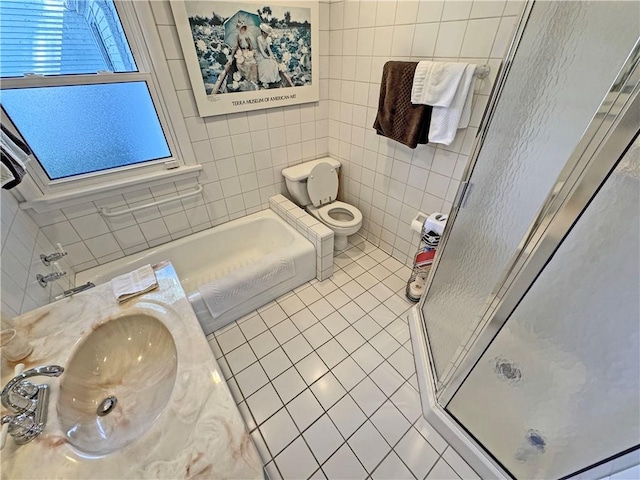 10 Danbury Cir N, Brighton, NY 14618 - bathroom featuring tile patterned floors, a shower stall, tile walls, and a garden tub