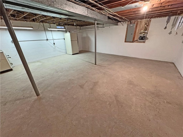 10 Danbury Cir N, Brighton, NY 14618 - unfinished below grade area with electric panel and freestanding refrigerator