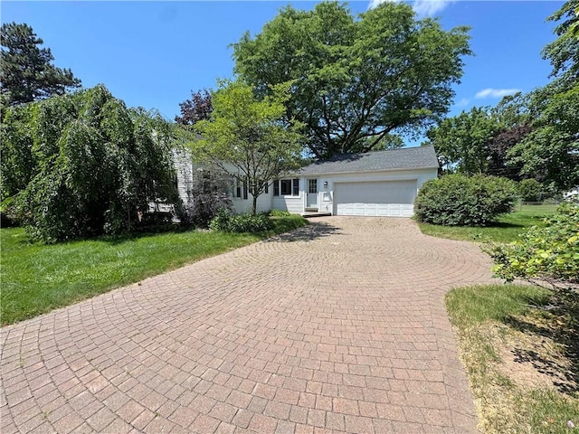 10 Danbury Cir N, Brighton, NY 14618 - view of front of home with decorative driveway, an attached garage, and a front lawn