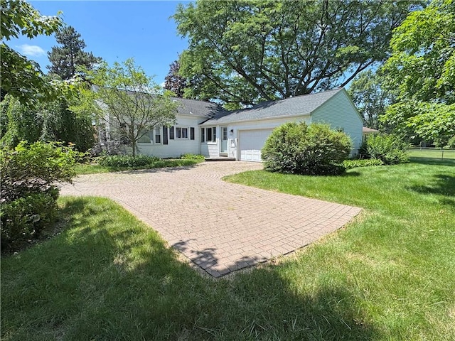 10 Danbury Cir N, Brighton, NY 14618 - view of green lawn with a garage and decorative driveway