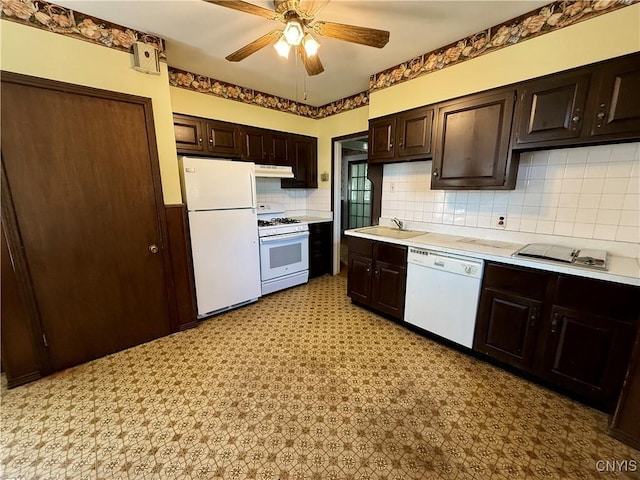 633 Pleasant St, Utica, NY 13501 - kitchen featuring white appliances, under cabinet range hood, light countertops, ceiling fan, and dark brown cabinets