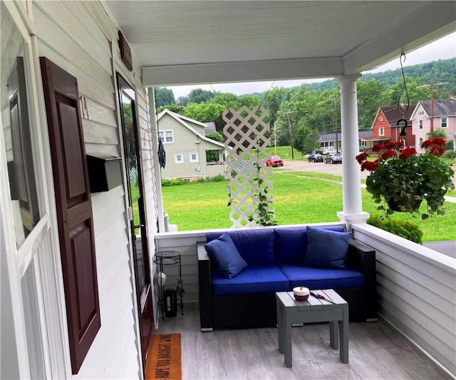 74 Cleveland Ave, Elmira, NY 14905 - porch featuring a lawn