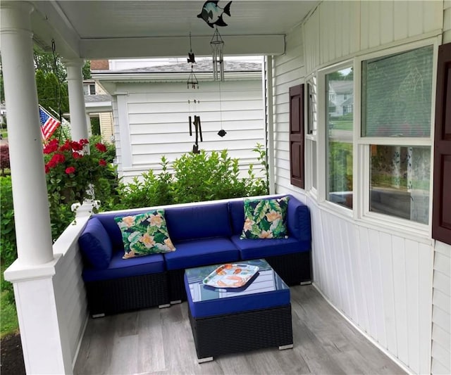 74 Cleveland Ave, Elmira, NY 14905 - covered porch featuring an outdoor living space