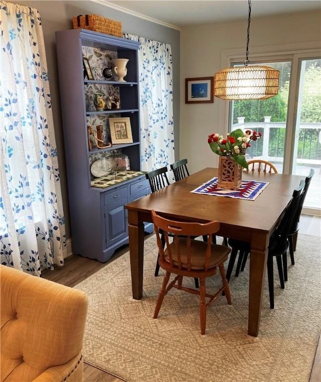 74 Cleveland Ave, Elmira, NY 14905 - dining space with light wood-type flooring and crown molding