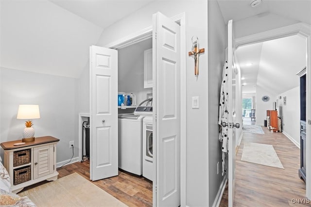 13 E Edgewater Dr, Fulton, NY 13069 - laundry area with independent washer and dryer, light wood finished floors, and cabinet space