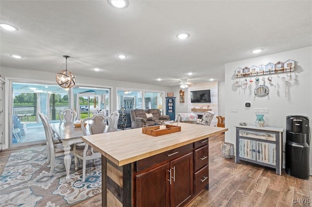 13 E Edgewater Dr, Fulton, NY 13069 - kitchen featuring wooden counters, recessed lighting, light wood-type flooring, hanging light fixtures, and ceiling fan