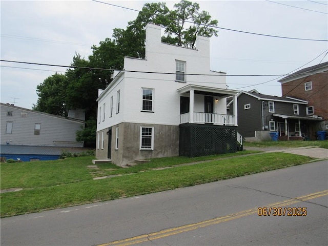 4 Geneva St, Lyons, NY 14489 - view of front of home featuring stucco siding and a front lawn