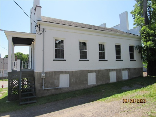 4 Geneva St, Lyons, NY 14489 - view of property exterior with a chimney