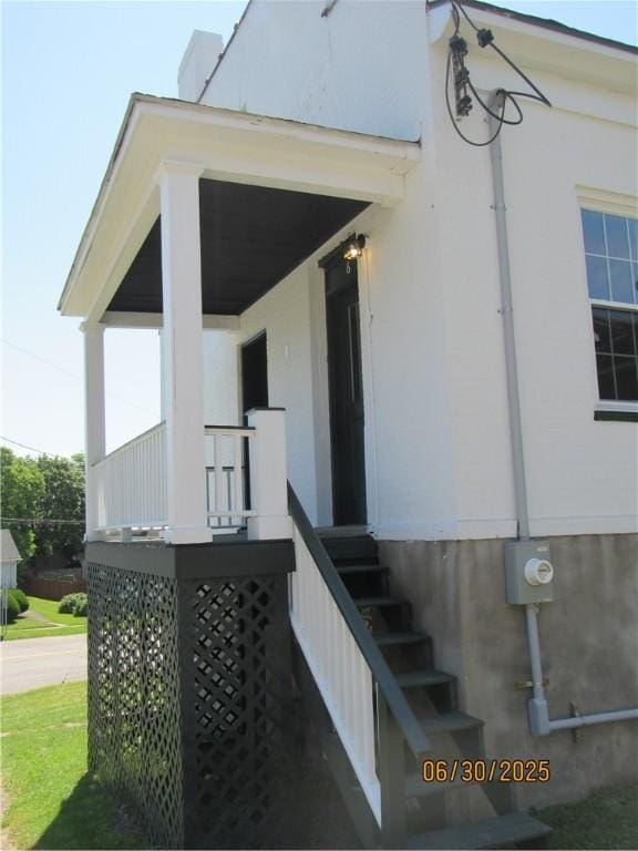 4 Geneva St, Lyons, NY 14489 - property entrance with stucco siding and covered porch