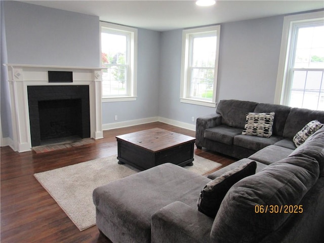 4 Geneva St, Lyons, NY 14489 - living area with wood finished floors and a fireplace with flush hearth