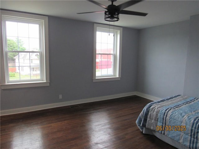 4 Geneva St, Lyons, NY 14489 - bedroom with dark wood-style flooring and ceiling fan